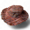 Textured fabric flower with frayed edges on a white background