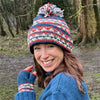hand knitted wristwarmers and bobble hat set