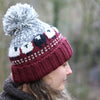 burgundy wool bobble hat with sheep
