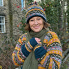 Matching Nordic style hand knit wool bobble hat and accessories 
