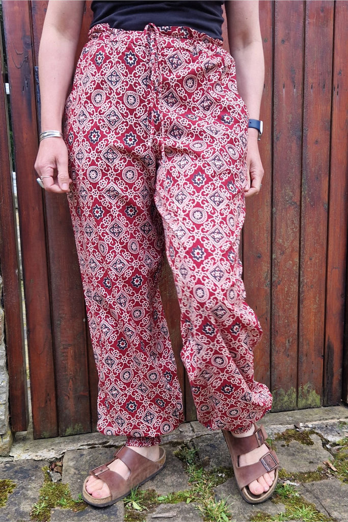 red hand printed cotton trousers