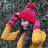bright red wool bobble hat and matching wirst warmers