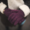 plum wool gloves worn by a model