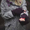 fingerless mittens in plum worn by a model