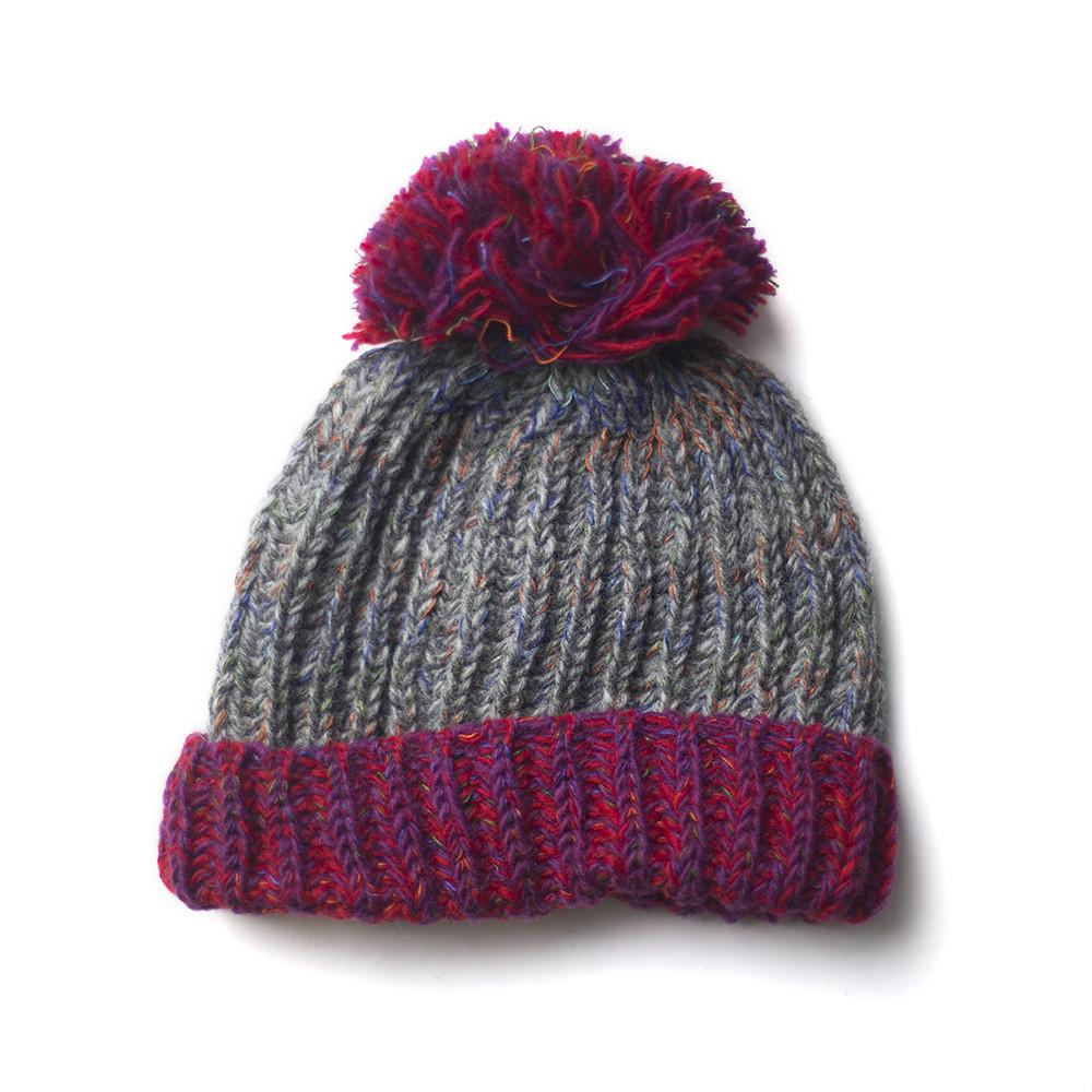 chunky knitted wool bobble hat with raspberry brim and pompom
