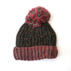 chunky knitted wool bobble hat with pink brim and pom pom 