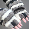 model wearing fingerless gloves with mitten flap in grey monochrome