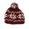 red bobble hat with nordic snowflake print